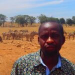 man-brings-water-wild-animals-kenya-10-58aac6f3a007f__700