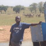 man-brings-water-wild-animals-kenya-11-58aac6f596bf3__700