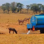 man-brings-water-wild-animals-kenya-14-58aac6ff63821__700